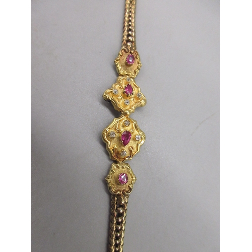 1 - Unmarked yellow gold bracelet with ruby and diamond set panels on articulated chain, tested to 22ct ... 