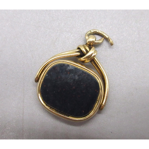 4 - 18ct yellow gold revolving fob set with bloodstone and carnelian, stamped 18, 9.4g