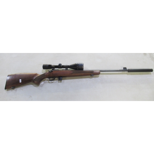 446 - Sako P945 .22 calibre bolt action rifle. With detachable moderator, Nikko scope, and original magazi... 