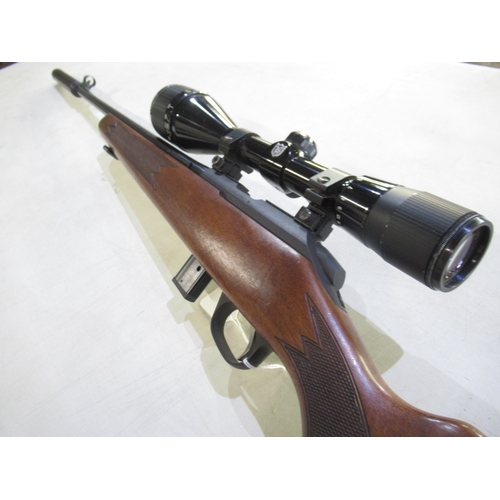 446 - Sako P945 .22 calibre bolt action rifle. With detachable moderator, Nikko scope, and original magazi... 