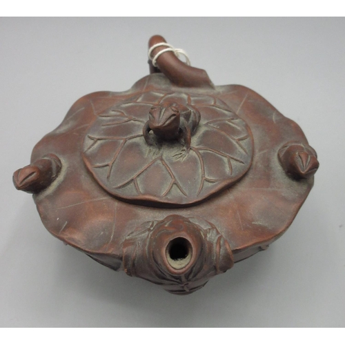 1003 - Chinese Yixing clay teapot with a tortoise cover in a tapered rectangular form, and a lotus flower f... 