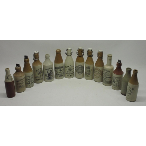 204 - A collection of fourteen Scottish stoneware ginger beer and stout bottles, including Perth, Hawick, ... 