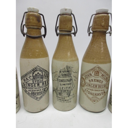 204 - A collection of fourteen Scottish stoneware ginger beer and stout bottles, including Perth, Hawick, ... 