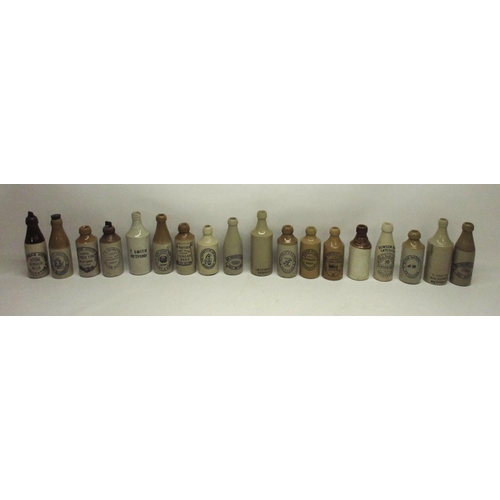 207 - A collection of eighteen stoneware ginger beer and stout bottles from across the midlands and north,... 