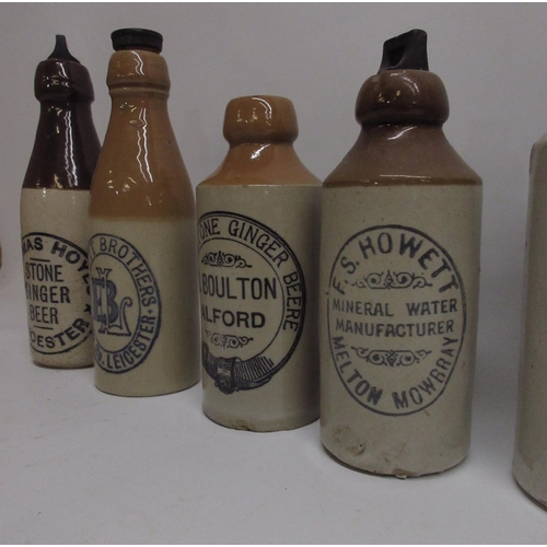 207 - A collection of eighteen stoneware ginger beer and stout bottles from across the midlands and north,... 