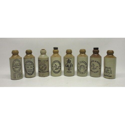 208 - A collection of eight stoneware ginger beer and stout bottles from Norwich and King's Lynn