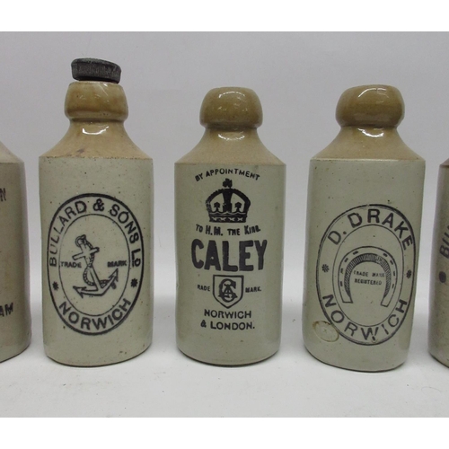 208 - A collection of eight stoneware ginger beer and stout bottles from Norwich and King's Lynn