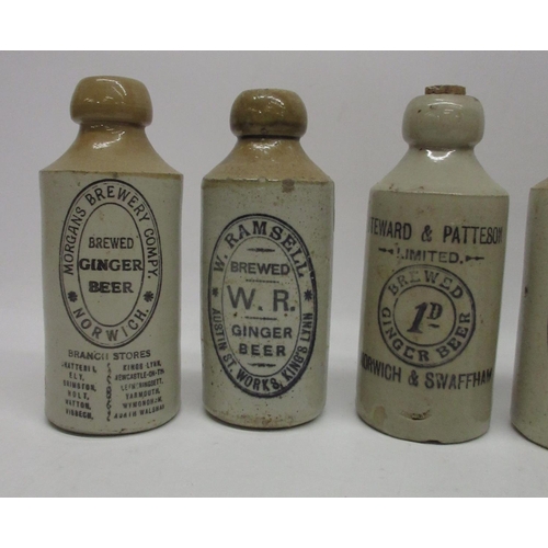 208 - A collection of eight stoneware ginger beer and stout bottles from Norwich and King's Lynn