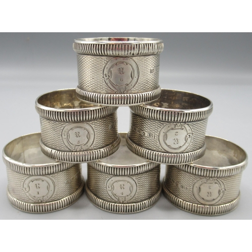 42 - Set of six Victorian silver napkin rings numbered 1 - 6 with engine turned pattern by George Unite, ... 