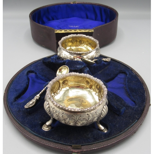 45 - George III silver pair of salts with three shell cast hoof feet, fluted rim, repousse floral decorat... 