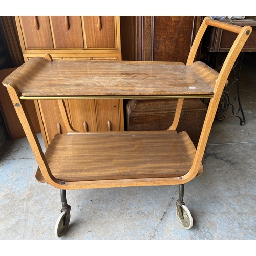 602 - Mid 20th century teak/plywood two tier wheeled hostess trolley with lift-out trays, H79cm W73.5cm D4... 