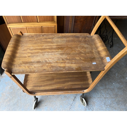 602 - Mid 20th century teak/plywood two tier wheeled hostess trolley with lift-out trays, H79cm W73.5cm D4... 