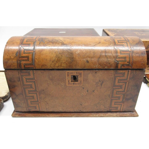 1028 - Walnut storage box with a domed top and decorated with cross banded veneer with two compartments ins... 