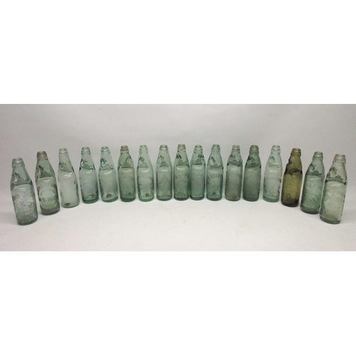 215 - Collection of seventeen Codd-neck glass bottles from across the Greater Manchester area, including M... 