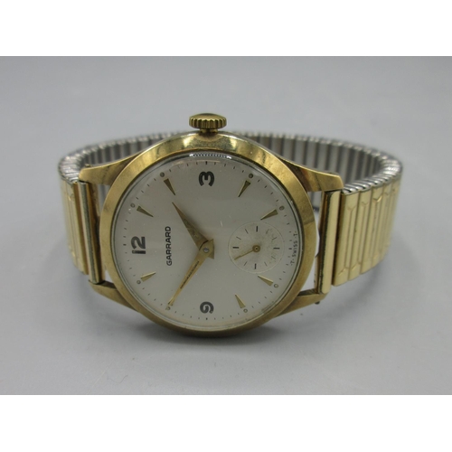 560 - 1960's Garrard presentation 9ct gold wristwatch, signed silvered dial, Arabic and baton hours, subsi... 