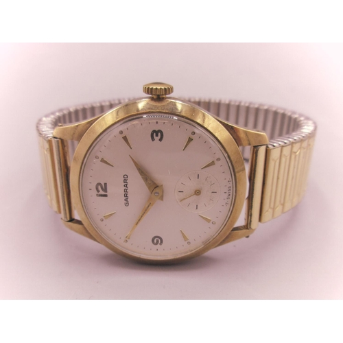 560 - 1960's Garrard presentation 9ct gold wristwatch, signed silvered dial, Arabic and baton hours, subsi... 