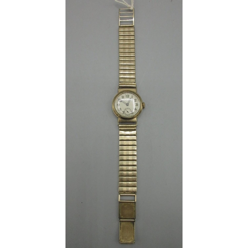 563 - 1940's Swiss 9ct gold Patent trench watch, silvered Arabic dial, subsidiary seconds, screw off case ... 