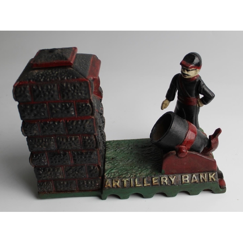 1201 - Cast iron money box showing an Artillery officer firing a cannon. THE ARTILLERY BANK