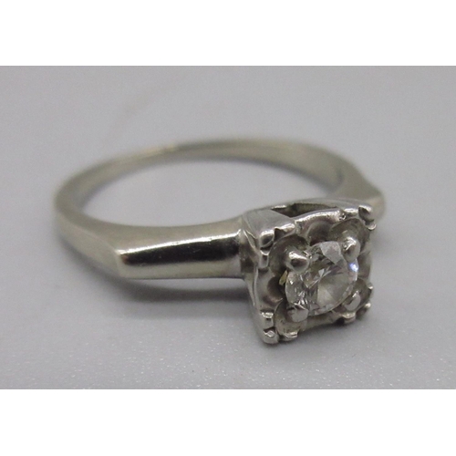 1296 - White metal diamond solitaire ring, set with single round cut diamond in ornate square mount, K1/2, ... 