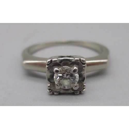 1296 - White metal diamond solitaire ring, set with single round cut diamond in ornate square mount, K1/2, ... 