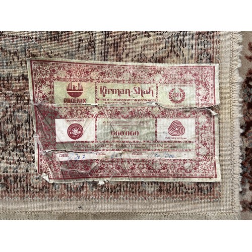 1131 - Kirman Shah cream ground wool rug, 140cm x 200cm