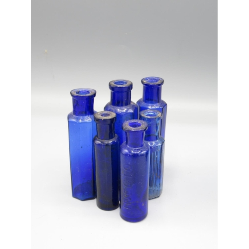 230 - Eleven small blue glass bottles, including four poison bottles (11)