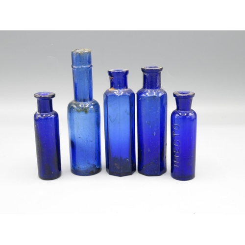 231 - Ten small blue glass bottles incl. three poison bottles and a 'Walfox Brand' bottle