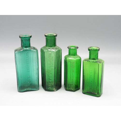 232 - Seven small green glass poison bottles incl. one with original Cooks of Lincoln shop sticker (7)