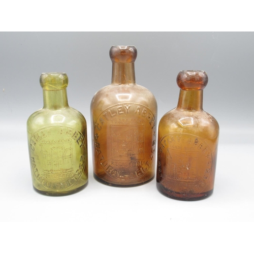 234 - Three amber and green glass Catley Abbey 'Natural Seltzer' bottles (3)