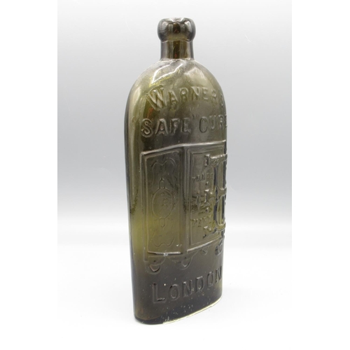 244 - Warner's Safe Cure bottle originating from London, with embossed text and logo, H24cm.