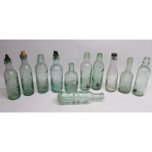 245 - Eleven clear glass antique bottles of various designs and eras, including Snowdrop, E. Painter and S... 