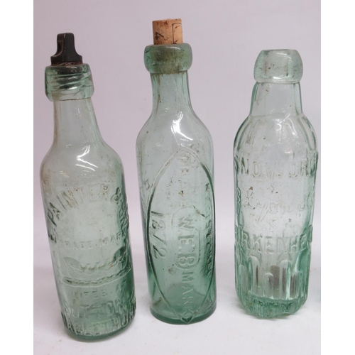 245 - Eleven clear glass antique bottles of various designs and eras, including Snowdrop, E. Painter and S... 