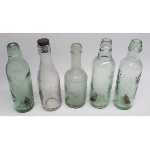 245 - Eleven clear glass antique bottles of various designs and eras, including Snowdrop, E. Painter and S... 