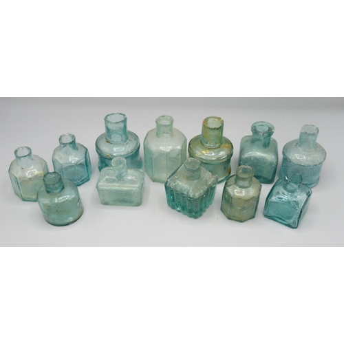 250 - Twelve various clear glass inkwells (12)