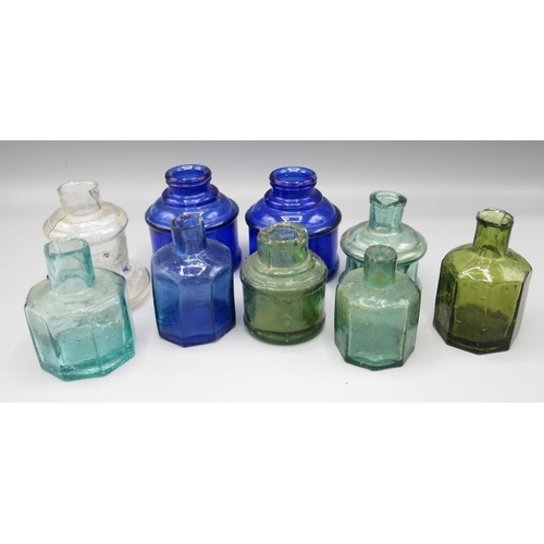 251 - Nine various glass inkwells (9)