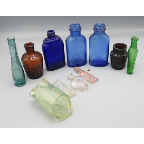 252 - Assorted glassware incl. an amber poison bottle, a blue 'Milk of Magnesia' bottle etc. (9)