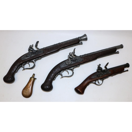 699 - Pair of replica flintlock pistols, L48cm, another similar pistol, and a 19th century copper and bras... 