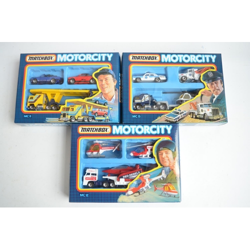 336 - Three boxed Matchbox MotorCity multi model sets MC11,12 and 13, models in mint condition, boxes at l... 