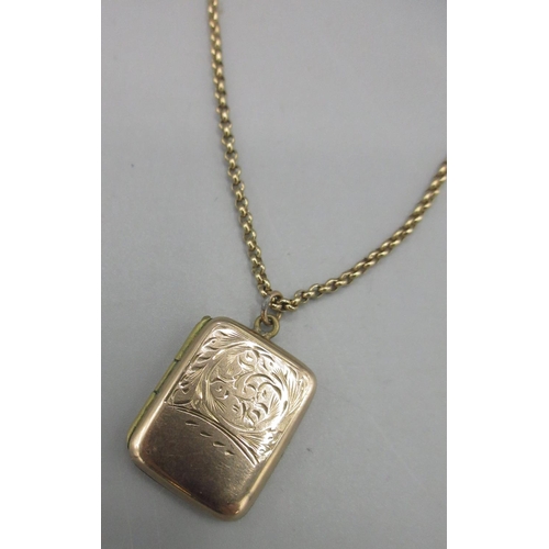 176 - 9ct yellow gold rectangular locket pendant with engraved foliage detail, stamped 9ct, on 9ct yellow ... 