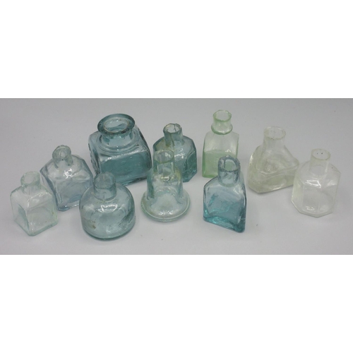 250A - Ten various clear glass inkwells (10)