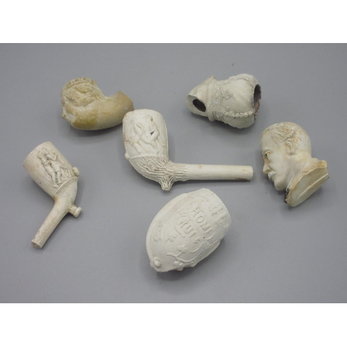 265 - Selection of clay pipes and fragments of various designs and eras, including football scenes, hawk t... 