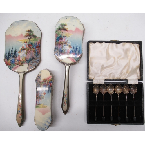 162 - Three piece silver plate dressing table set decorated with a enamel landscape incl, two brushes and ... 