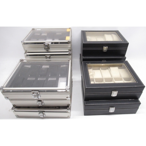 552 - Seven aluminium watch display cases to display ten watches, W26cm and five similar leather finish wa... 