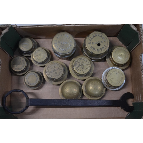 281 - Twelve vintage brass carriage wheel nuts to include 2x Burlington Carriage Co Ltd (315 Oxford Street... 