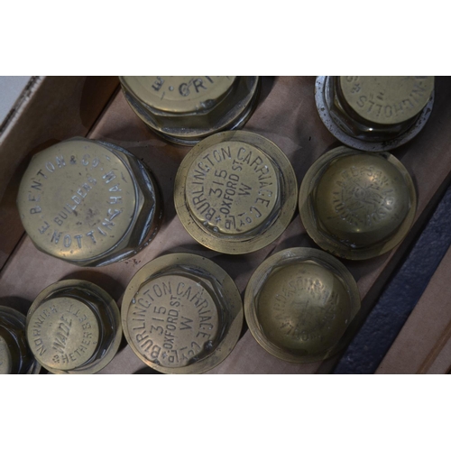 281 - Twelve vintage brass carriage wheel nuts to include 2x Burlington Carriage Co Ltd (315 Oxford Street... 