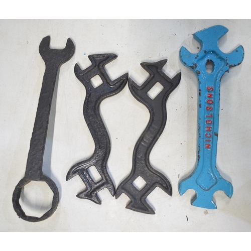 285 - Collection of vintage cast steel cogs (repainted) and 4 spanners/wrenches, one marked Nicholsons. La... 