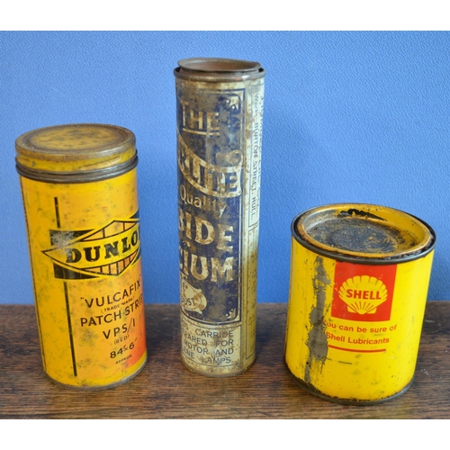 286 - Three vintage steel tins to include Shell grease (partially full), Dunlop and Bryterlite, 2x Esso Fl... 