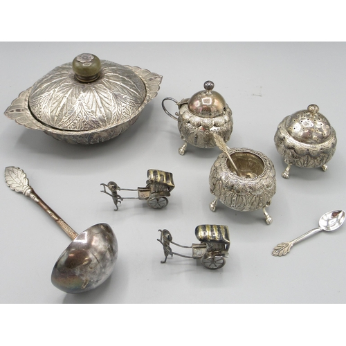 195 - Kelantan silver cruet set comprising a salt, pepper and mustard pot with spoons, a similar dish and ... 