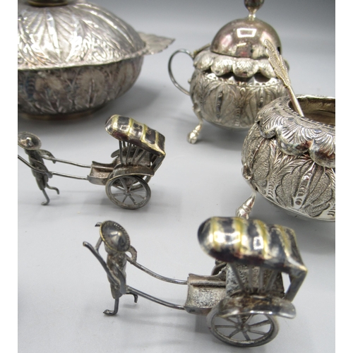 195 - Kelantan silver cruet set comprising a salt, pepper and mustard pot with spoons, a similar dish and ... 