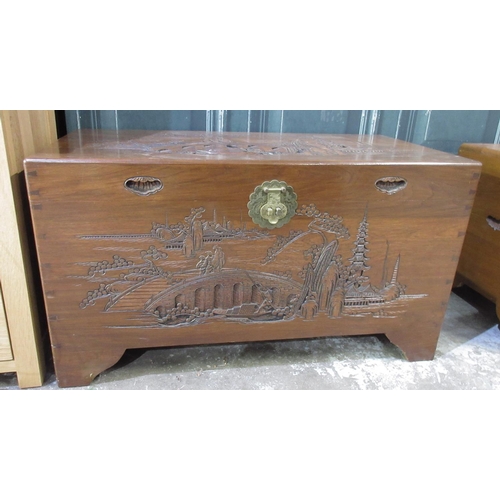 744 - Chinese camphor lined blanket box carved with landscapes, brass lock on bracket feet, W101cm D50cm H... 